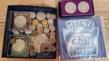 A nox of assorted UK coins to include Isle of Man 50p, commemorative crowns & a 1983 Heinz..