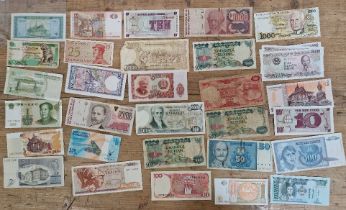 A large collection of assorted world banknotes