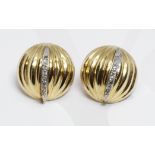 A pair of diamond earrings, marked 'J14K', diameter 15mm, gross weight 2.9g.