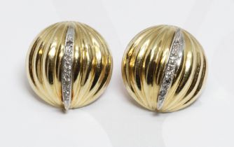 A pair of diamond earrings, marked 'J14K', diameter 15mm, gross weight 2.9g.