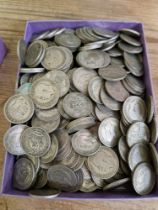 A tray of one shilling coins, dated 1920 to 1946, approx. 2.1kg weight.