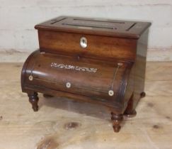 A 19th century Rosewood and mother of pearl inlaid stationary box modelled as a piano, length 23.