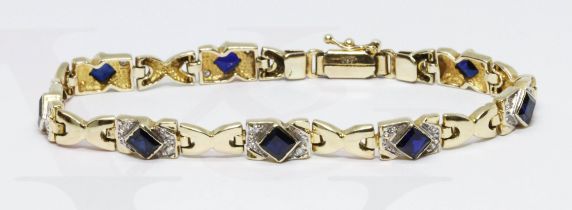 A synthetic sapphire and colourless stone bracelet, marked '585', length 19cm, gross weight 16.1g.