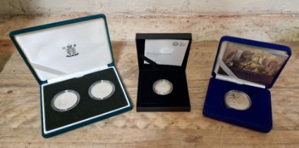 Royal Mint, Three silver coins/sets comprising.....