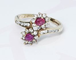 A hallmarked 9ct gold diamond and ruby cluster ring, gross weight 2.5g, size L/M.