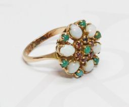 A garnet, opal and turquoise cluster ring, the cluster measuring approximately 17mm in diameter,