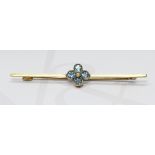 An Edwardian aquamarine and seed pearl bar brooch, marked '15'm length 55mm, gross weight 2.8g.