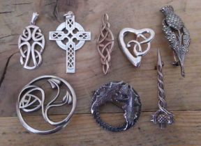 Eight Scottish and Celtic style brooches and pendants including hallmarked silver. 1.44 ozt