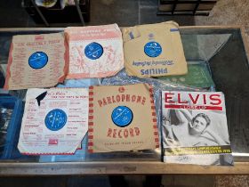 Six vintage Elvis Presley records together with an 'Elvis close up' book.