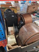 A box containing 9 clocks and a metronome