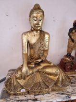 A large Eastern gilt seated Buddha figure, height 88cm (approx).