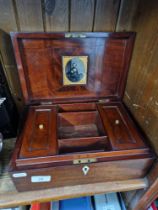 A 19th century mahogany jewellery/sewing box with fitted interior.
