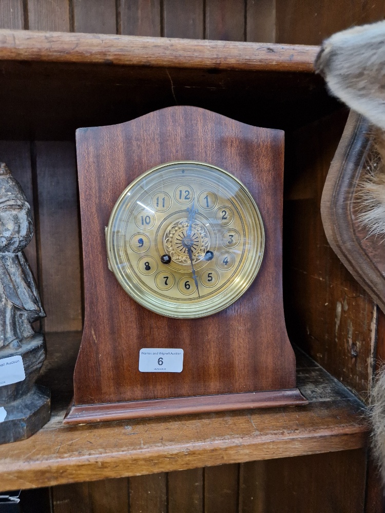 A French mahogany cased bracket clock with brass dial, complete with pendulum and key.