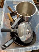 A box of kitchen ware to include a Kuhn Rikon Swiss pressure cooker, Tefal pans, a cast iron flat