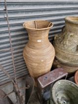 An very large Indonesian Rattan vase and a brown Belfast sink.