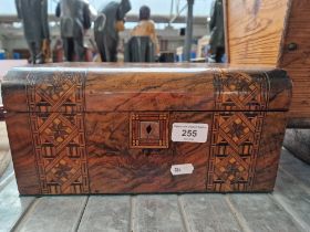 A vintage inlaid wooden jewellery box with brass name plate