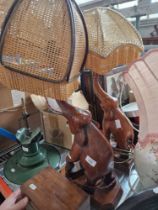 A pair of wooden carved elephants lights and a pottery table lamp.