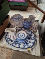 A tray of blue and white pottery.