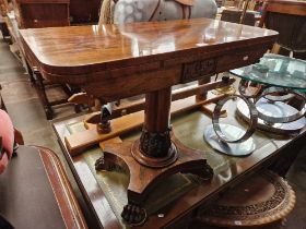 A William IV rosewood pedestal tea table on paw feet.