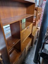 A mid 20th century teak lounge unit, teak nest of tables and a bureau/side cabinet.