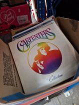 A box of Carpenters LPs.