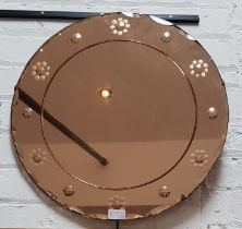 1930s Art Deco peach glass wall mirror, 50cm diameter.