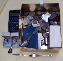 A box of mixed coins and collectables.