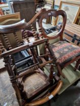 An early 20th century carved oak armchair together with three other chairs.