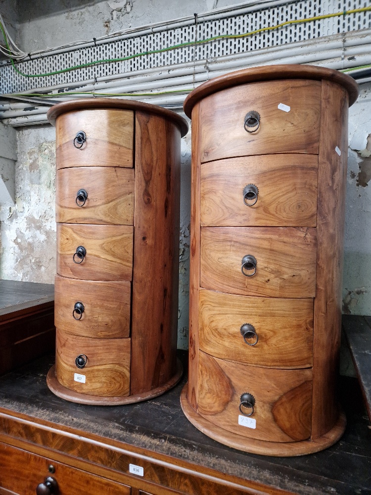 A pair of hardwood chests of drawers.
