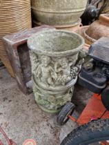 Two cherub decorated planters.