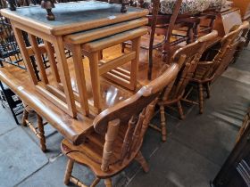 A pine dining table and six chairs.
