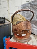 A copper coal scuttle with various brass and copper items to include charger, etc.