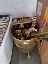 A brass coal bucket, brass fire irons, miniature miner's lamp, trivets, etc.