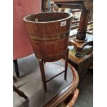 A brass bound oak planter on stand by R. Alister & Co Ltd, Dursley, England.
