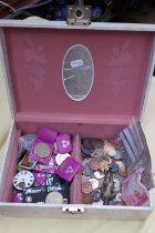 A box containing UK and world coins, banknotes, silver brooch, cast metal figure, etc.