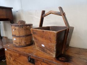 Two wooden well buckets; one Chinese and another.