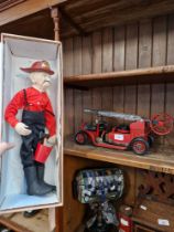 An Elder Folk fireman doll together with a scratch built model fire engine.