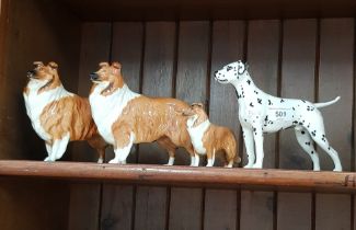 Three Beswick collie dogs and a Beswick dalmation