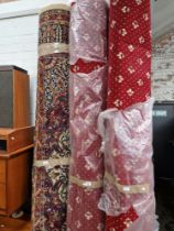Two rolls of red patterned carpet.width approx. 2.7m, length unknown.