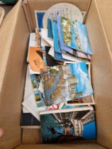 A box of vintage postcards.