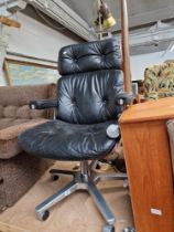 A mid 20th century Giroflex leather and chrome swivel chair designed by Karl Dittert for Martin