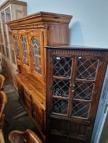 A stained pine dresser together with a glazed oak corner cabinet