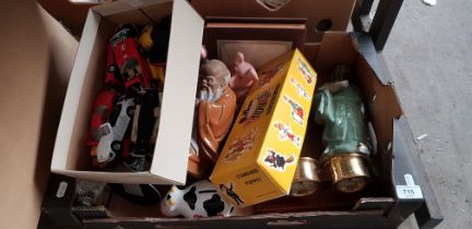 A box of assorted items including Wade Nat West pigs, a Pelham puppet, die-cast cars etc.