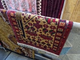 A late 20th century Middle Eastern carpet, made in Pakistan and decorated with tanks, grenades and