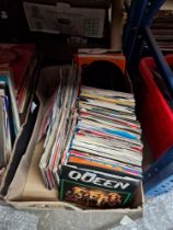 A box of vinyl singles, over 200 including Queen, Freddie & the Dreamers, The Hollies, UB40,