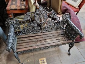 A Coalbrookdale style cast iron garden bench, pierced oak leaf and ivy decoration with lioness