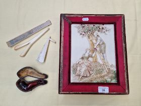 A vintage chocolate box together with a ladies leg pipe and plastic glove stretchers, and two fans.