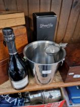 A boxed Grand Cru Brut champagne by Janisson & Fils together with a stainless steel Ikea wine