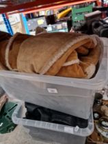 Two boxes of sheepskin and leather clothing.