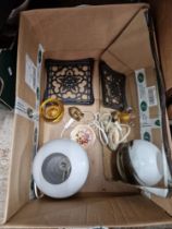 A box of assorted items including a Tibetan buddha head, a mirror glass etc.